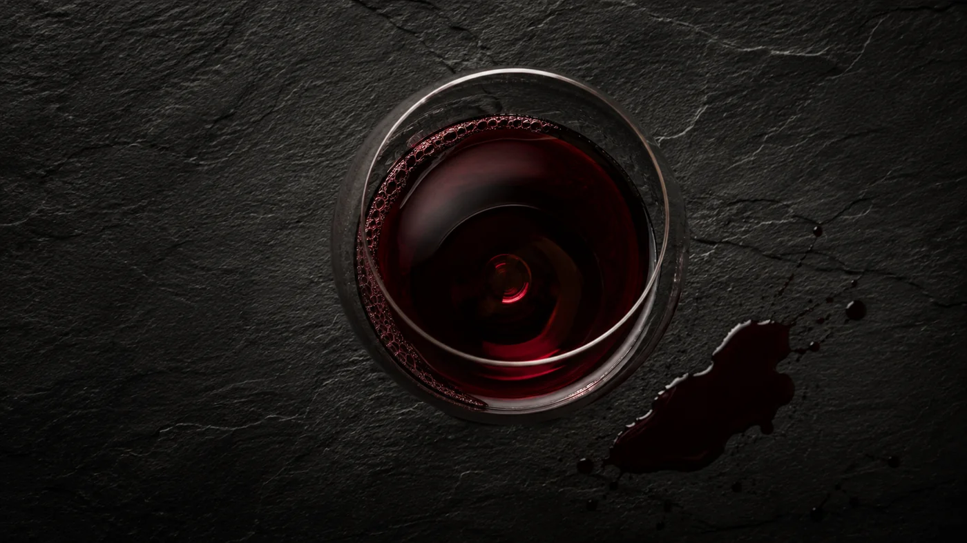 Premium Burgundy red wine being poured